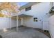 Private backyard with covered patio and access to unit at 647 Greenbriar Townhouse Way, Las Vegas, NV 89121