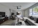 Virtually staged living room featuring contemporary furniture and decor at 647 Greenbriar Townhouse Way, Las Vegas, NV 89121