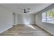 Bright living room with new wood-look floors and ceiling fan at 647 Greenbriar Townhouse Way, Las Vegas, NV 89121