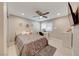 Spacious bedroom with plush bedding and a vanity area at 6640 Palmyra Ave, Las Vegas, NV 89146