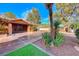 Front entrance with decorative gate and brick accents at 6640 Palmyra Ave, Las Vegas, NV 89146