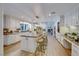 Modern kitchen with large island, white cabinetry, and granite counters at 6640 Palmyra Ave, Las Vegas, NV 89146