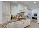 Bright kitchen features granite countertops and white cabinetry at 6640 Palmyra Ave, Las Vegas, NV 89146