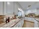 Spacious kitchen with granite countertops, white cabinets, and stainless steel appliances at 6640 Palmyra Ave, Las Vegas, NV 89146