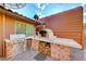 Outdoor kitchen featuring a pizza oven and grill at 6640 Palmyra Ave, Las Vegas, NV 89146