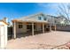 Home's backyard featuring a covered patio, and a brick-paved area at 7233 Eaglegate St, Las Vegas, NV 89131