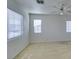 Bright bedroom featuring neutral carpet, ceiling fan, and double windows at 7233 Eaglegate St, Las Vegas, NV 89131