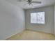 Bedroom with neutral carpet, a ceiling fan and a window at 7233 Eaglegate St, Las Vegas, NV 89131