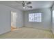 Bedroom featuring carpeted floors, a ceiling fan and a window at 7233 Eaglegate St, Las Vegas, NV 89131