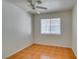 Cozy bedroom featuring tile flooring and natural light from window at 7233 Eaglegate St, Las Vegas, NV 89131