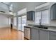 Bright kitchen featuring stainless appliances, granite counters, and ample cabinet space at 7233 Eaglegate St, Las Vegas, NV 89131