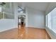 Living room featuring tile flooring, staircase, high ceilings, and access to other rooms at 7233 Eaglegate St, Las Vegas, NV 89131