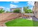 Backyard with patio, lawn and block wall at 7490 Thistle Poppy St, Las Vegas, NV 89139