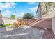 Patio with seating area and small lawn at 7490 Thistle Poppy St, Las Vegas, NV 89139