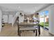 Dining area with table, bench, and access to backyard at 7490 Thistle Poppy St, Las Vegas, NV 89139