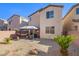 Backyard with patio cover and hammock at 7638 Peaceful Trellis Dr, Las Vegas, NV 89179