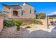 Landscaped backyard with gravel and patio area at 7638 Peaceful Trellis Dr, Las Vegas, NV 89179