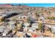 Aerial view of the house and surrounding neighborhood with mountain views at 801 7Th St, Boulder City, NV 89005