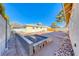 Backyard with raised garden bed and pathway at 801 7Th St, Boulder City, NV 89005