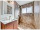 Modern bathroom with a walk-in shower, new vanity, and updated fixtures at 801 7Th St, Boulder City, NV 89005