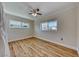 Well-lit bedroom featuring wood-look floors and large windows at 801 7Th St, Boulder City, NV 89005