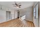 Spacious bedroom with wood-look floors, ceiling fan, and ample closet space at 801 7Th St, Boulder City, NV 89005