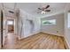 Bedroom with wood-look floors, ceiling fan, and en-suite bathroom access at 801 7Th St, Boulder City, NV 89005