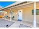 White front door entrance with a welcoming porch and sitting area at 801 7Th St, Boulder City, NV 89005