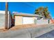 Detached garage with white door and block wall at 801 7Th St, Boulder City, NV 89005