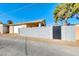 Detached garage with black gate and block wall at 801 7Th St, Boulder City, NV 89005