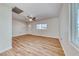 Living room with hardwood floors, large window, and ceiling fan at 801 7Th St, Boulder City, NV 89005