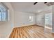 Living room with wood floors, white walls, and a ceiling fan at 801 7Th St, Boulder City, NV 89005