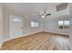 Bright and airy living room with light wood flooring and ceiling fan at 801 7Th St, Boulder City, NV 89005