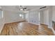 Bright living room with wood-look floors and ceiling fan at 801 7Th St, Boulder City, NV 89005