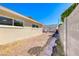 Side yard with rock border and partial view of home at 801 7Th St, Boulder City, NV 89005