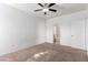 Bedroom with bathroom access and ceiling fan at 8250 N Grand Canyon Dr # 2073, Las Vegas, NV 89166