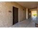 Condo hallway with private door and carpet flooring at 8250 N Grand Canyon Dr # 2073, Las Vegas, NV 89166