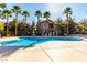 Community pool with a surrounding patio at 8250 N Grand Canyon Dr # 2073, Las Vegas, NV 89166