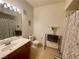 Bathroom featuring modern vanity, toilet, decorative curtain, and tiled flooring at 833 Aspen Peak Loop # 1014, Henderson, NV 89011