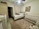 Spacious bedroom with a queen bed, crib, and ample closet space at 833 Aspen Peak Loop # 1014, Henderson, NV 89011