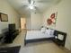 Well-lit bedroom featuring a ceiling fan, wall art, and view into the connecting bathroom at 833 Aspen Peak Loop # 1014, Henderson, NV 89011