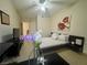 Bright bedroom boasts a ceiling fan, tile flooring, and coordinated furniture and decor at 833 Aspen Peak Loop # 1014, Henderson, NV 89011