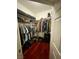 Large walk-in closet with double hanging rods and shelves at 833 Aspen Peak Loop # 1014, Henderson, NV 89011