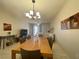 View of the dining room and living room featuring a ceiling light fixture at 833 Aspen Peak Loop # 1014, Henderson, NV 89011