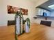 Dining room table with decorative centerpieces and an open view to the kitchen at 833 Aspen Peak Loop # 1014, Henderson, NV 89011