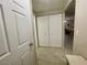 Hallway showcasing a double door closet and a glimpse into the living space at 833 Aspen Peak Loop # 1014, Henderson, NV 89011