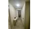 Hallway featuring tile flooring and neutral paint, connecting various rooms in the home at 833 Aspen Peak Loop # 1014, Henderson, NV 89011