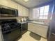 Modern kitchen featuring black appliances and ample counter space at 833 Aspen Peak Loop # 1014, Henderson, NV 89011