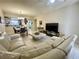 View of the open living room into the dining room and kitchen, with tile floors at 833 Aspen Peak Loop # 1014, Henderson, NV 89011