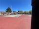 Two lighted tennis courts with red surface at 833 Aspen Peak Loop # 1014, Henderson, NV 89011